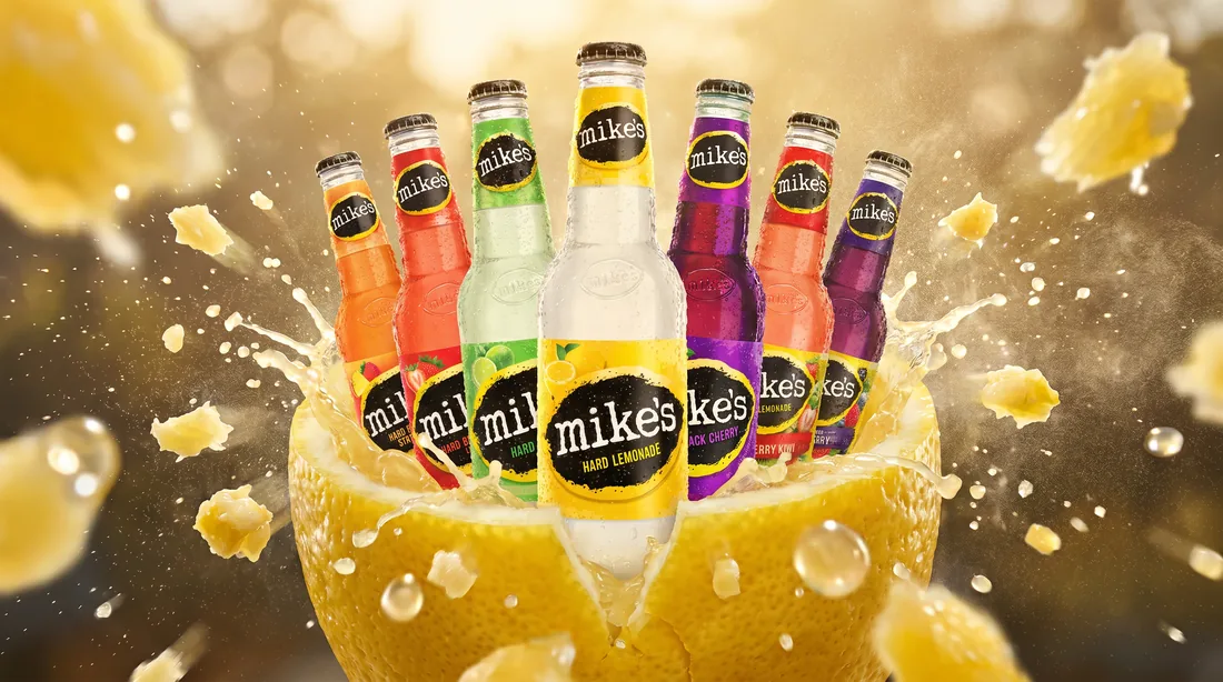 Mike's Hard Lemonade bottles bursting from a lemon, CGI campaign render